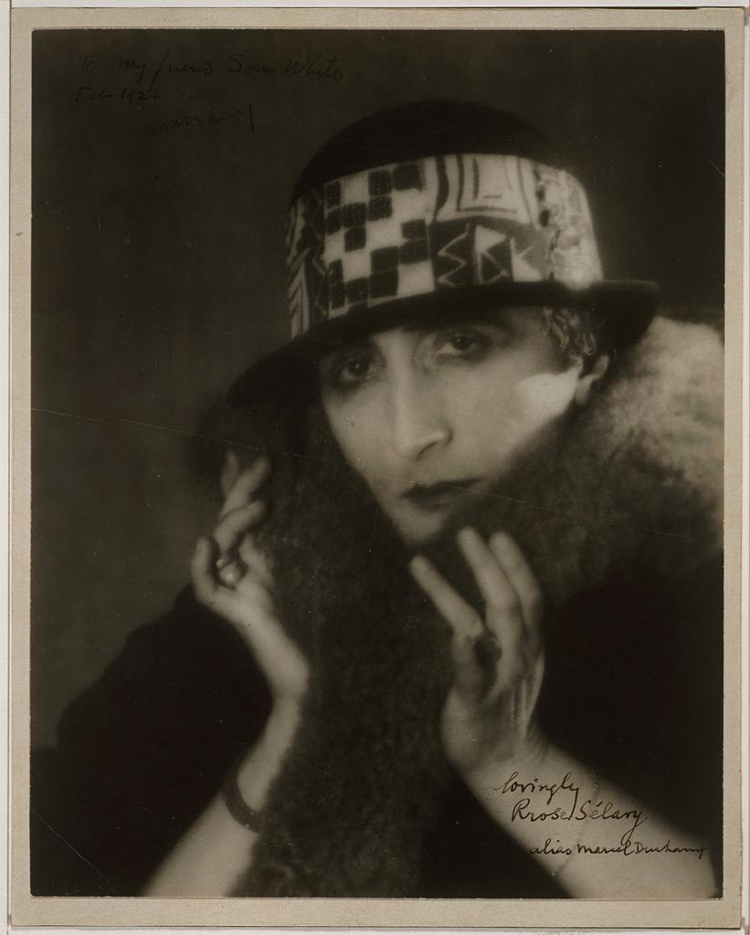 Man Ray, Marcel Duchamp as Rrose Sélavy (1920-21). Gelatin silver print, hand-retouched by Duchamp in black ink and pencil. Smithsonian, Donald W. Reynolds Center for American Art and Portraiture. National Portrait Gallery.